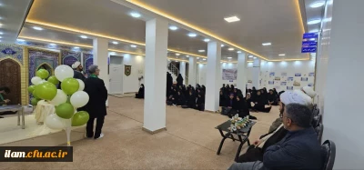 حضور خادمان حرم حضرت معصومه (س) به همراه پرچم گنبد حرم مطهر در دانشگاه فرهنگیان استان ایلام